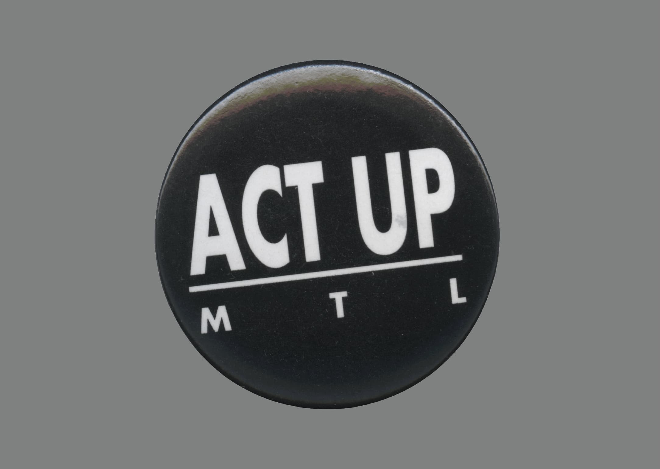 Act up Montréal pin badge