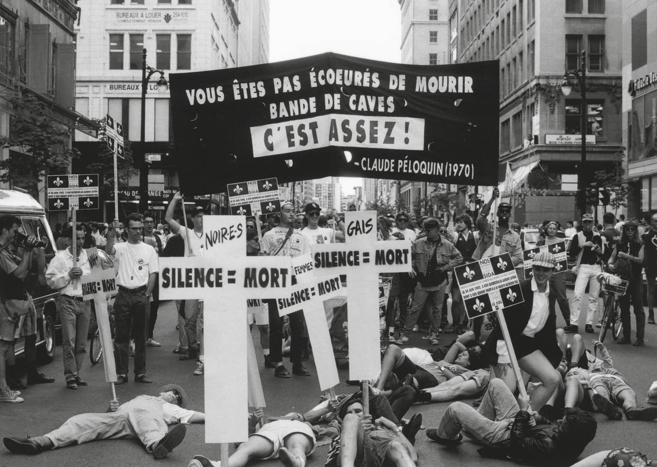 A black-and-white photograph showing a happening by the ACT UP collective.