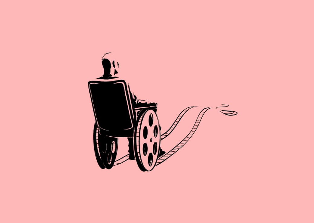 Personne dans un fauteuil roulant sur une pellicule de film.