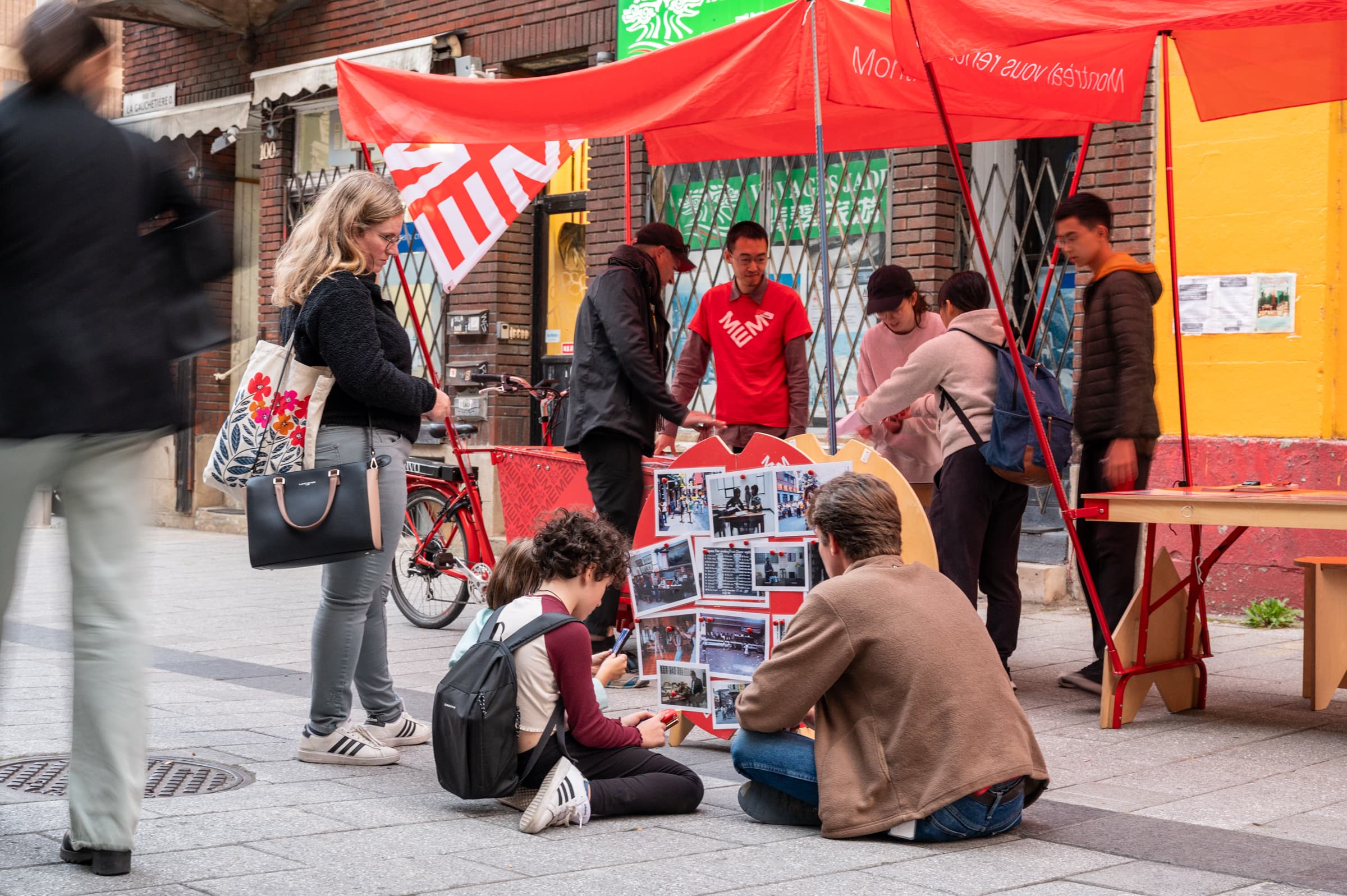 Person placing an archive photo in a red box marked with a question mark.